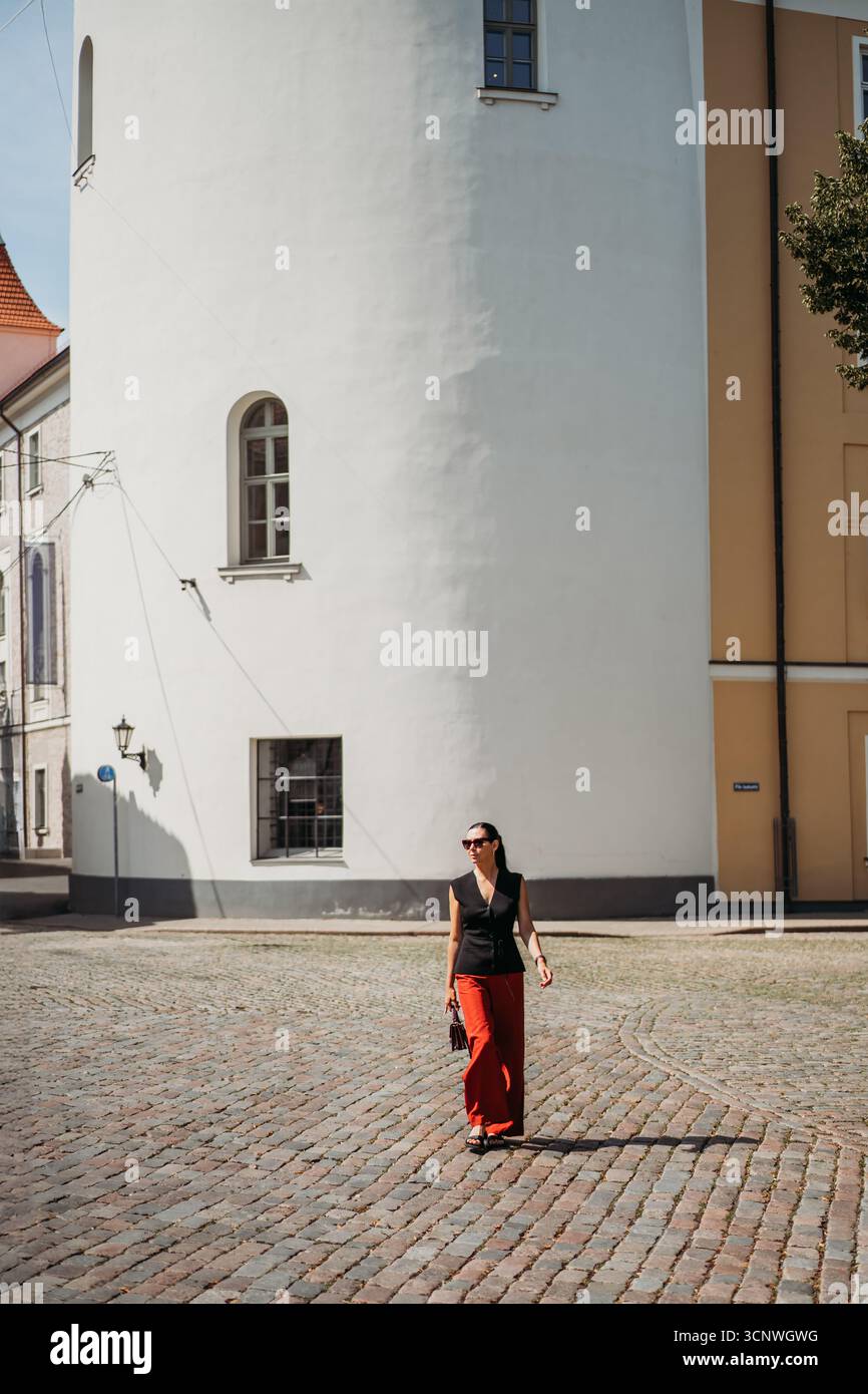 Woman in white pants walks hi-res stock photography and images - Alamy