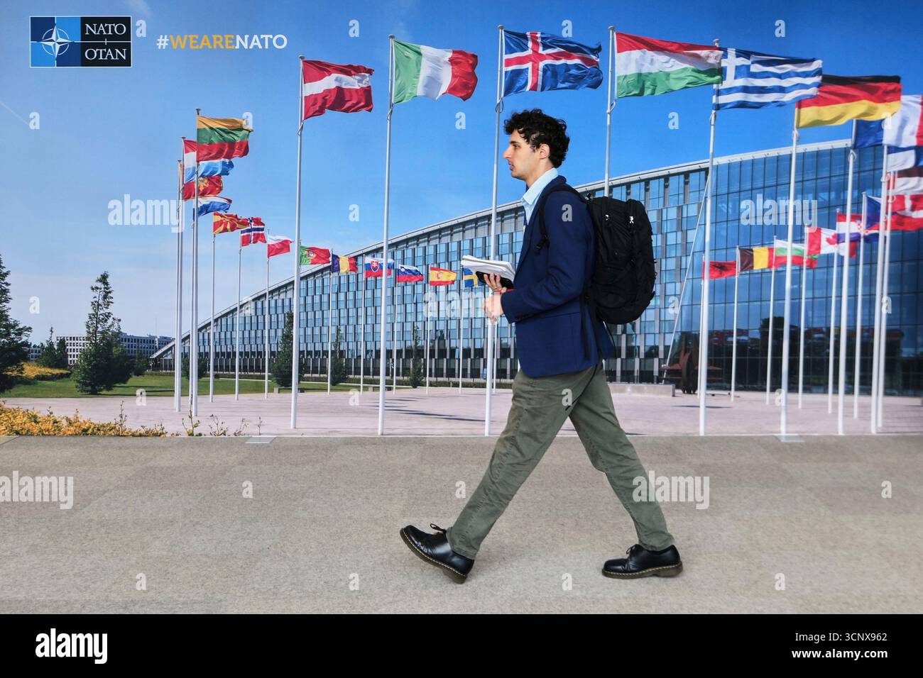 A Man Walks By A Mural With Flags Of NATO Member Countries At NATO A Man Walks By A Mural With Flags Of Nato Member Countries At Nato In Brussels Tuesday Sept 23 2025 Ap Mayo 3CNX962 