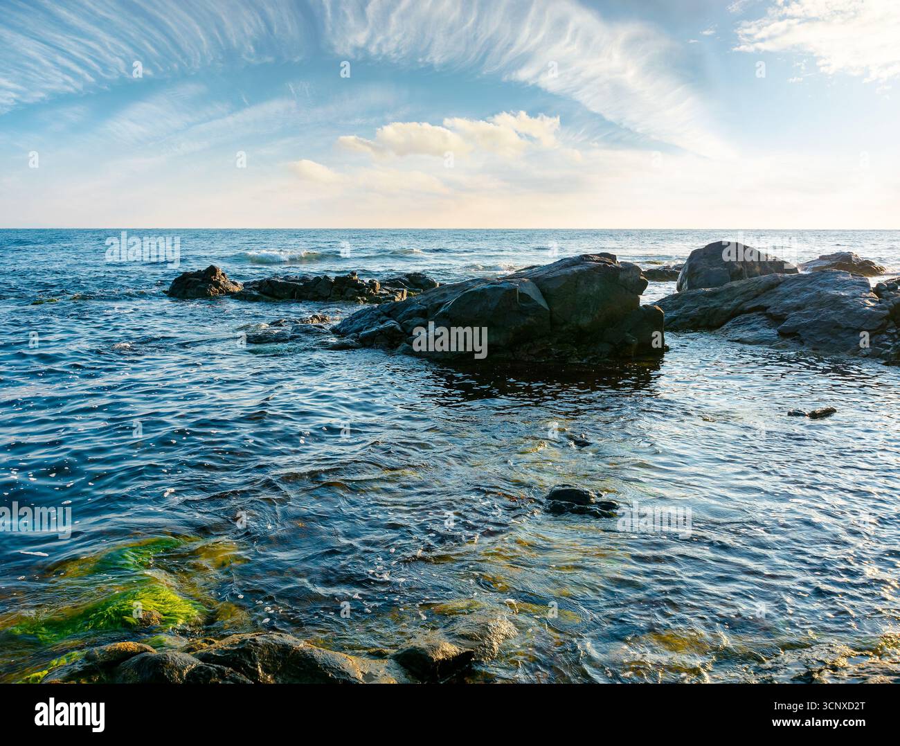 sea coast with rocks and boulders morning light. calm summer vacation background at the black sea. wonderful scene for relax and leisure at the seasid Stock Photo