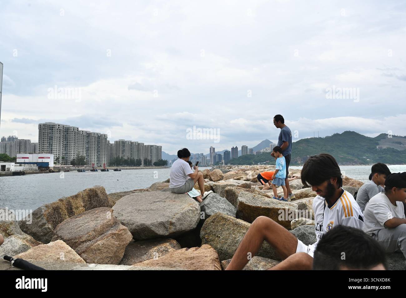 Signals Ragasa People watch the wave near the sea at Chai Wan on September 23, 2025 in ...