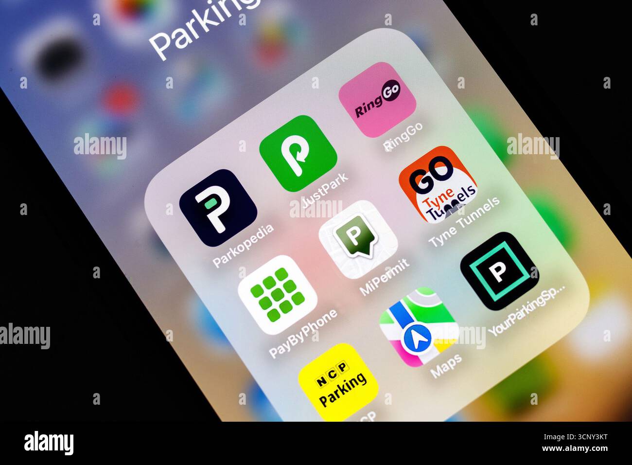 iphone Smartphone screen displaying several parking and navigation apps including Parkopedia and RingGo on a colorful background Stock Photo