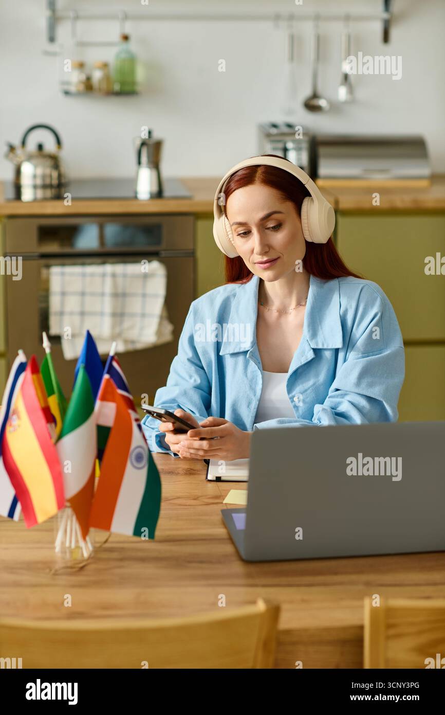 Remote language teacher engages with her students through laptop while working from home. Stock Photo