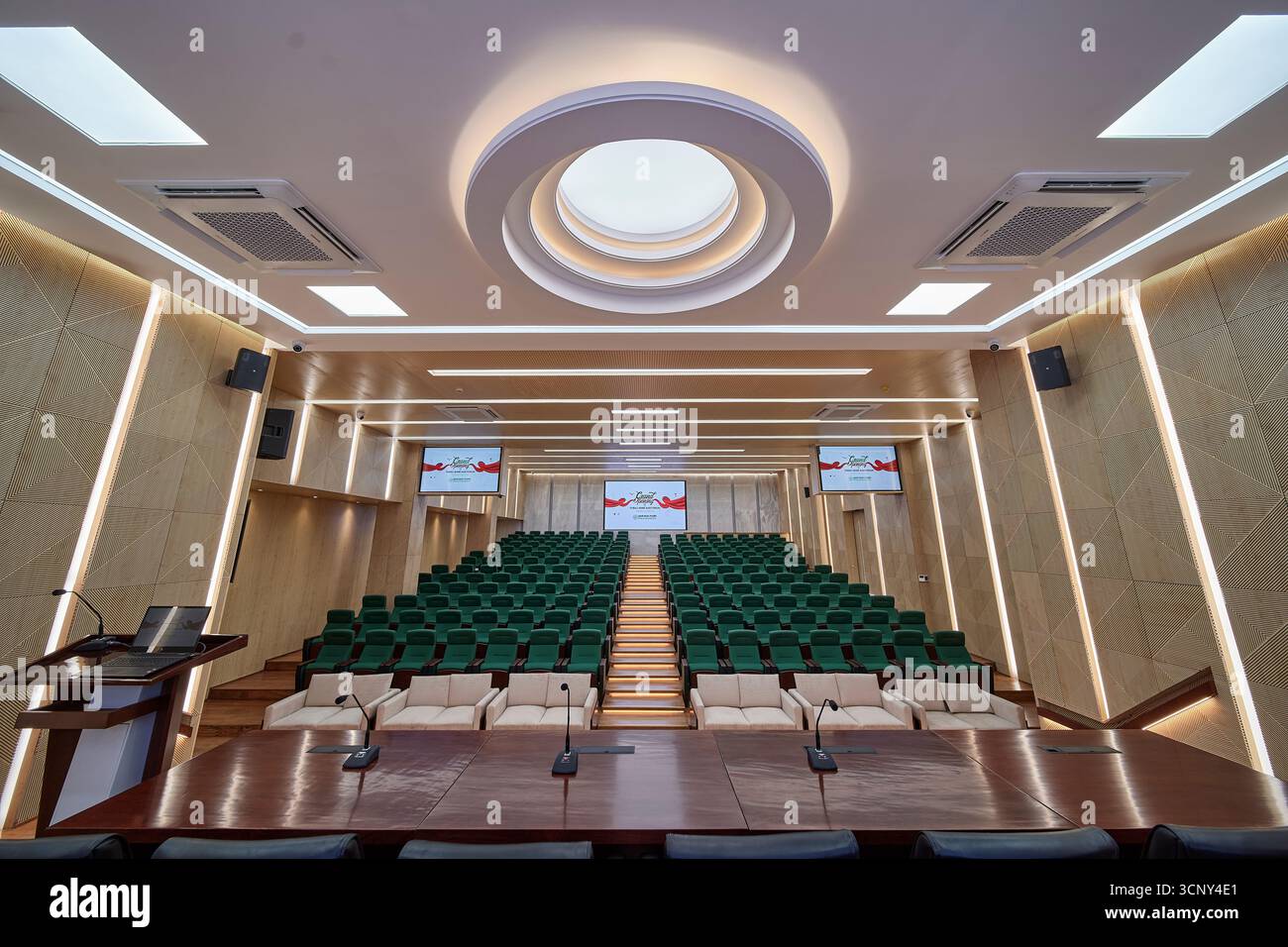 Modern Auditorium with Tiered Seating and a Circular Skylight Stock Photo