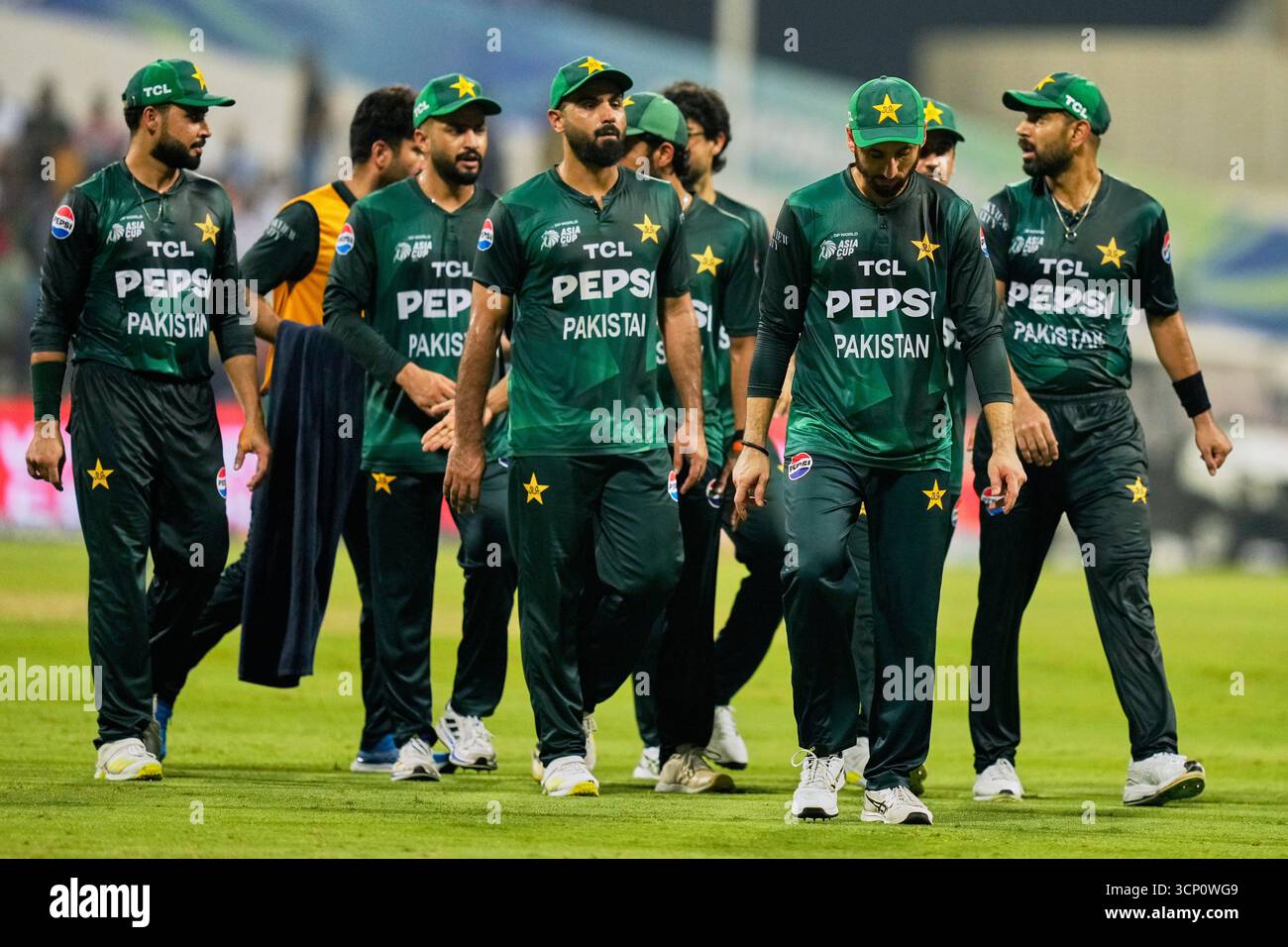 Pakistan players walk back at the end of first innings during the Asia ...