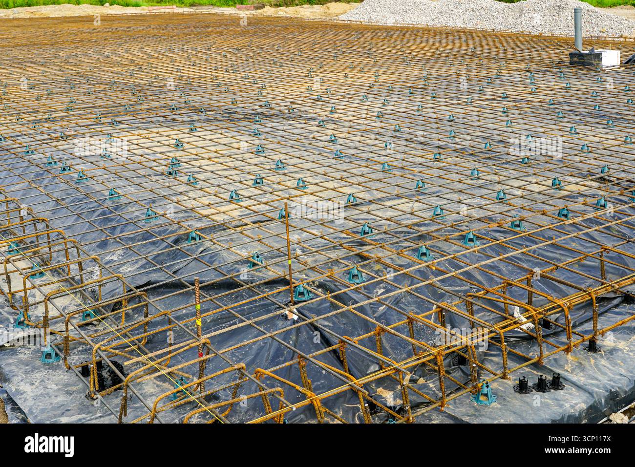 Steel rebar mesh foundation with plastic vapor barrier prepared for ...