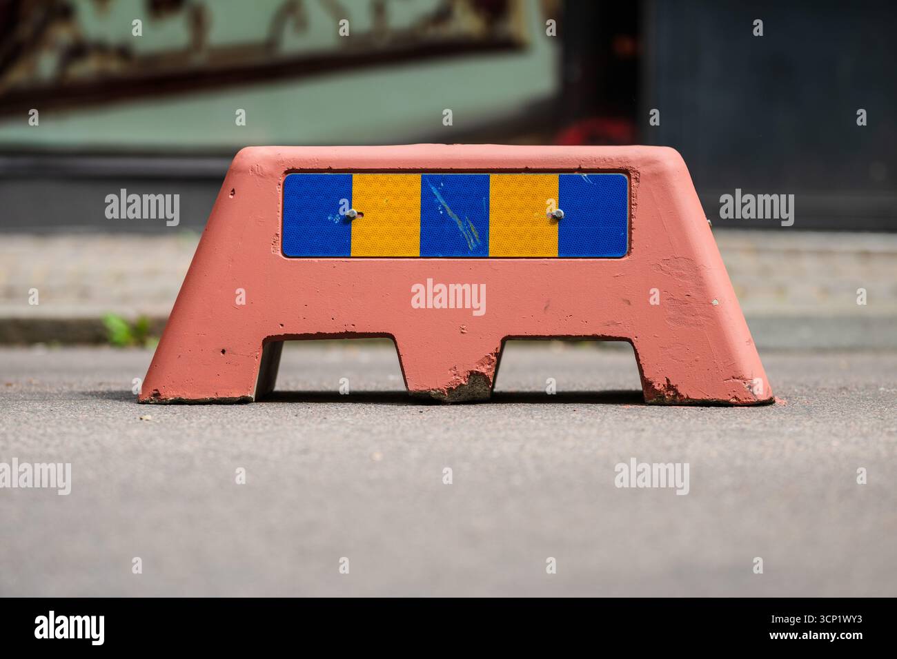 Closeup of damaged pink traffic barricade Stock Photo