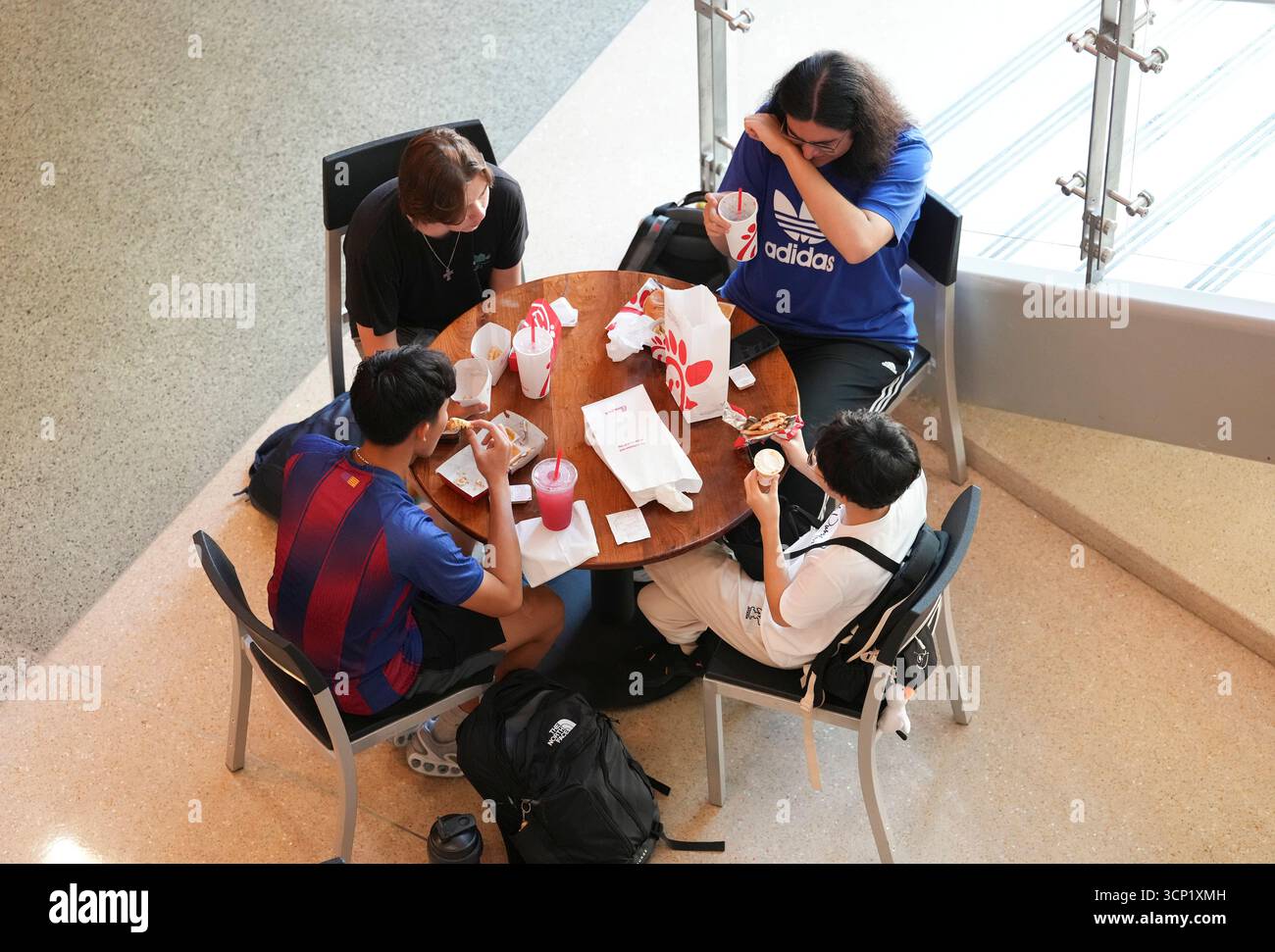 College students eat fast food while taking a study break over the lunch hour at the William C. Powers Student Activity Center at the University of Texas at Austin on September 11, 2025. UT-Austin has enrolled over 50,000 students for the fall, 2025 semester. Stock Photo