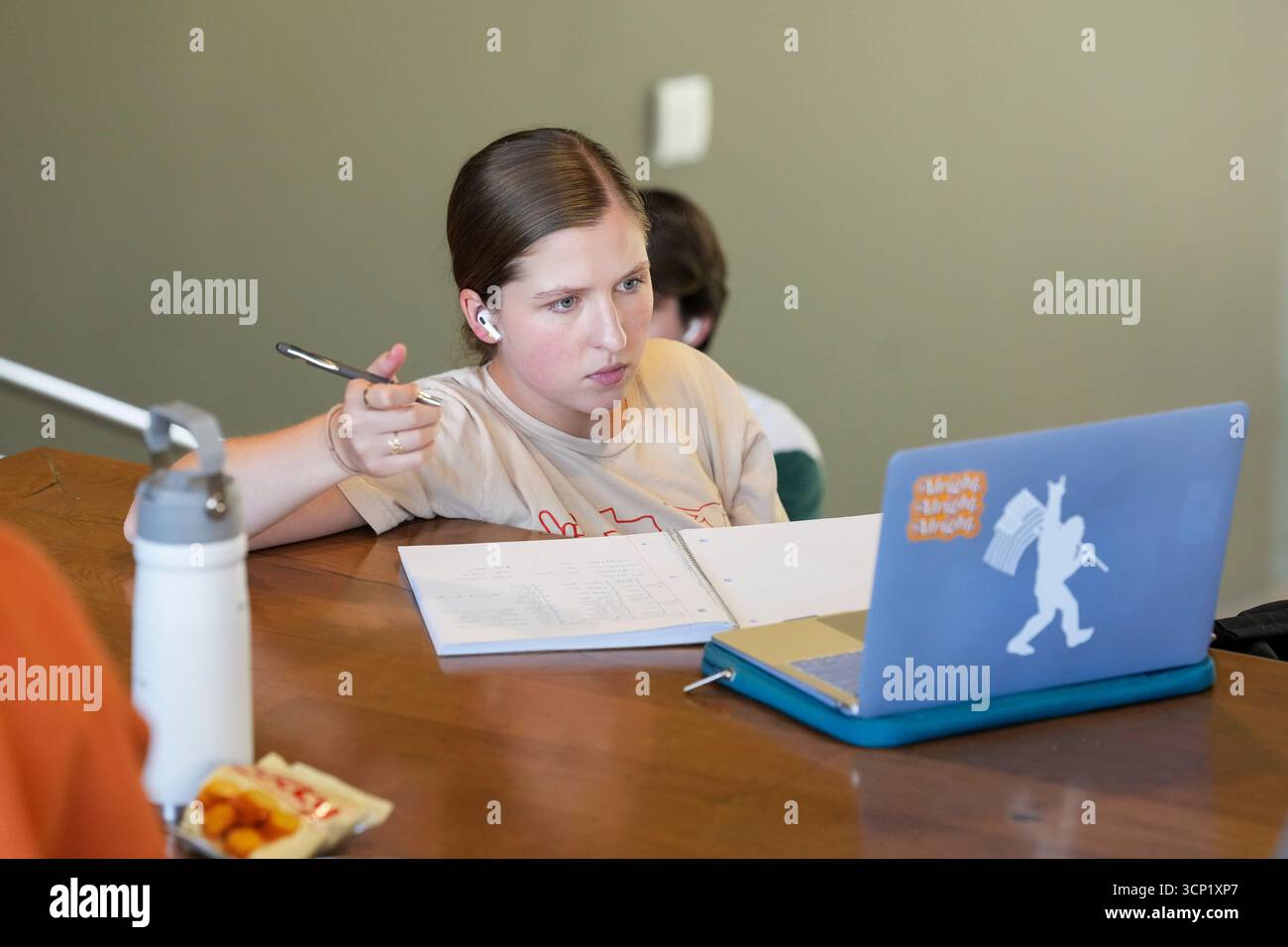 Student using her laptop computer and taking notes over the lunch hour at the William C. Powers Student Activity Center at the University of Texas at Austin on September 11, 2025. UT-Austin has enrolled over 50,000 students for the fall, 2025 semester. ©Bob Daemmrich Stock Photo