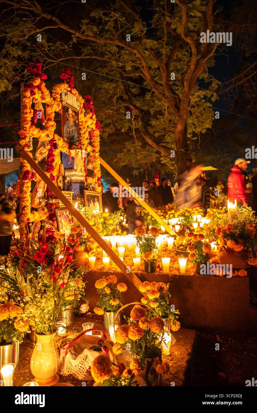 Celebration of Day of the Dead with decoration of the cemetery and a candlelight vigil in tzintzuntzan, michoacan, mexico. Stock Photo