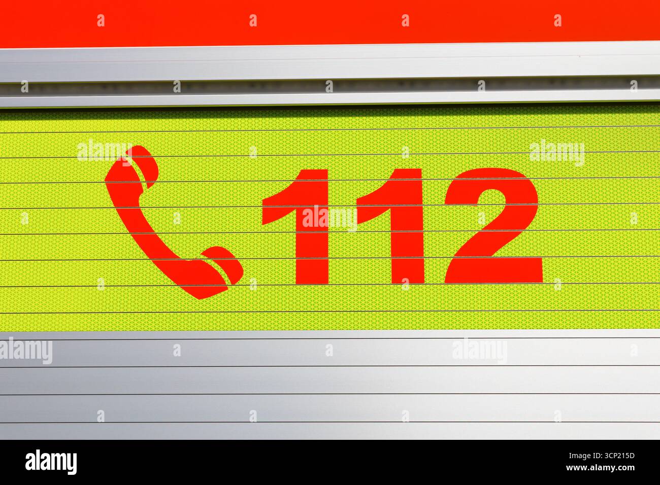 112 - European emergency telephone number. Detail on bright colorful surface. Stock Photo