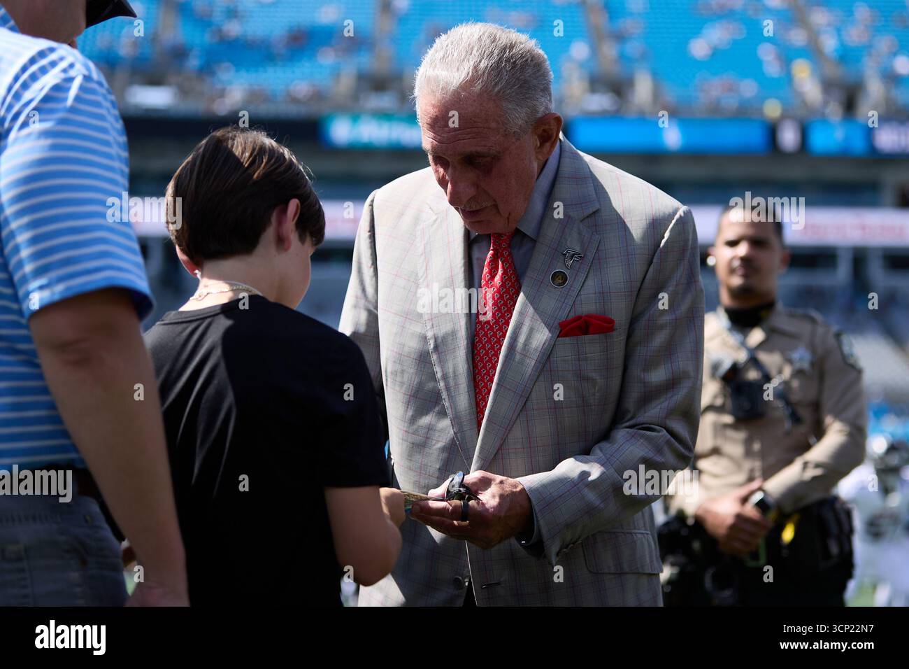 Falcons Owner Atlanta Falcons owner Arthur Blank signs an autograph for a young fan ...