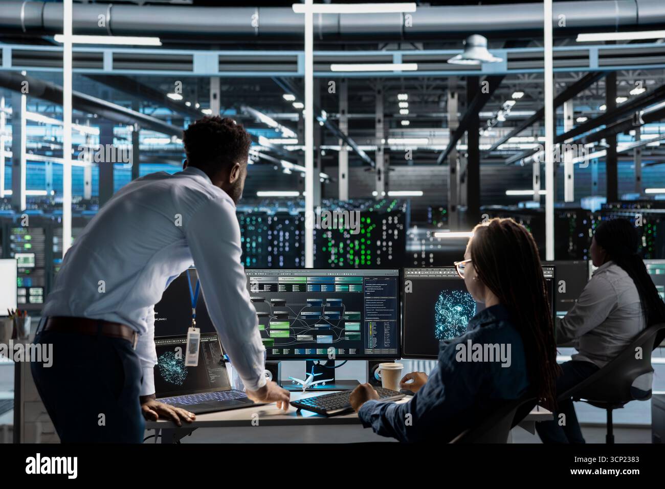 Data center manager supervises engineer using AI visual programming to optimize gear. Server farm team leader overseeing work done by worker colleagues using artificial intelligence analysis software Stock Photo