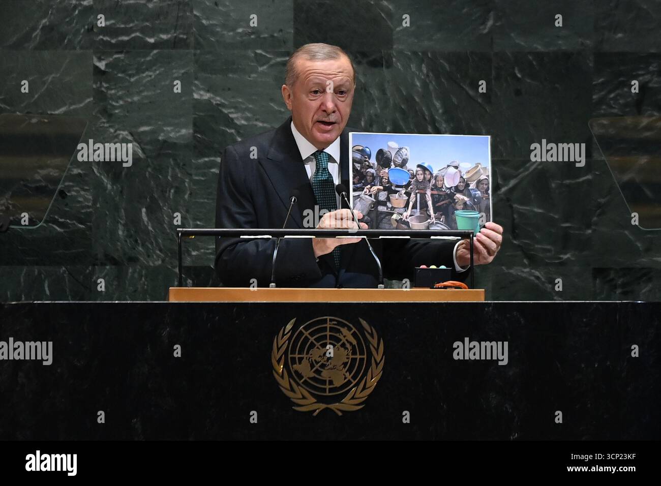 United Nations. 23rd Sep, 2025. Turkish President Recep Tayyip Erdogan displays a picture from Gaza as he delivers a speech during the General Debate of the 80th session of the United Nations General Assembly (UNGA) at the UN headquarters in New York, Sept. 23, 2025. Credit: Li Rui/Xinhua/Alamy Live News Stock Photo