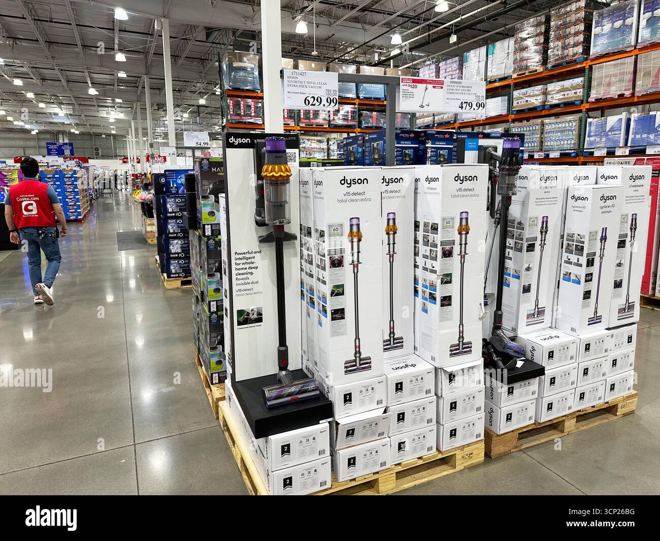 Stick vacuums stand on display in a Costco warehouse Tuesday, Sept. 23 ...