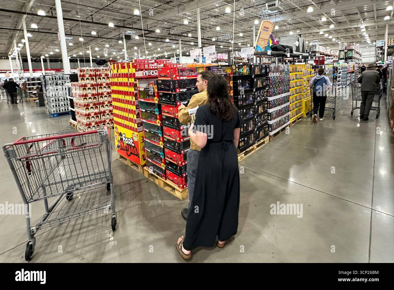 Shoppers consider a urchase in a Costco warehouse Tuesday, Sept. 23 ...