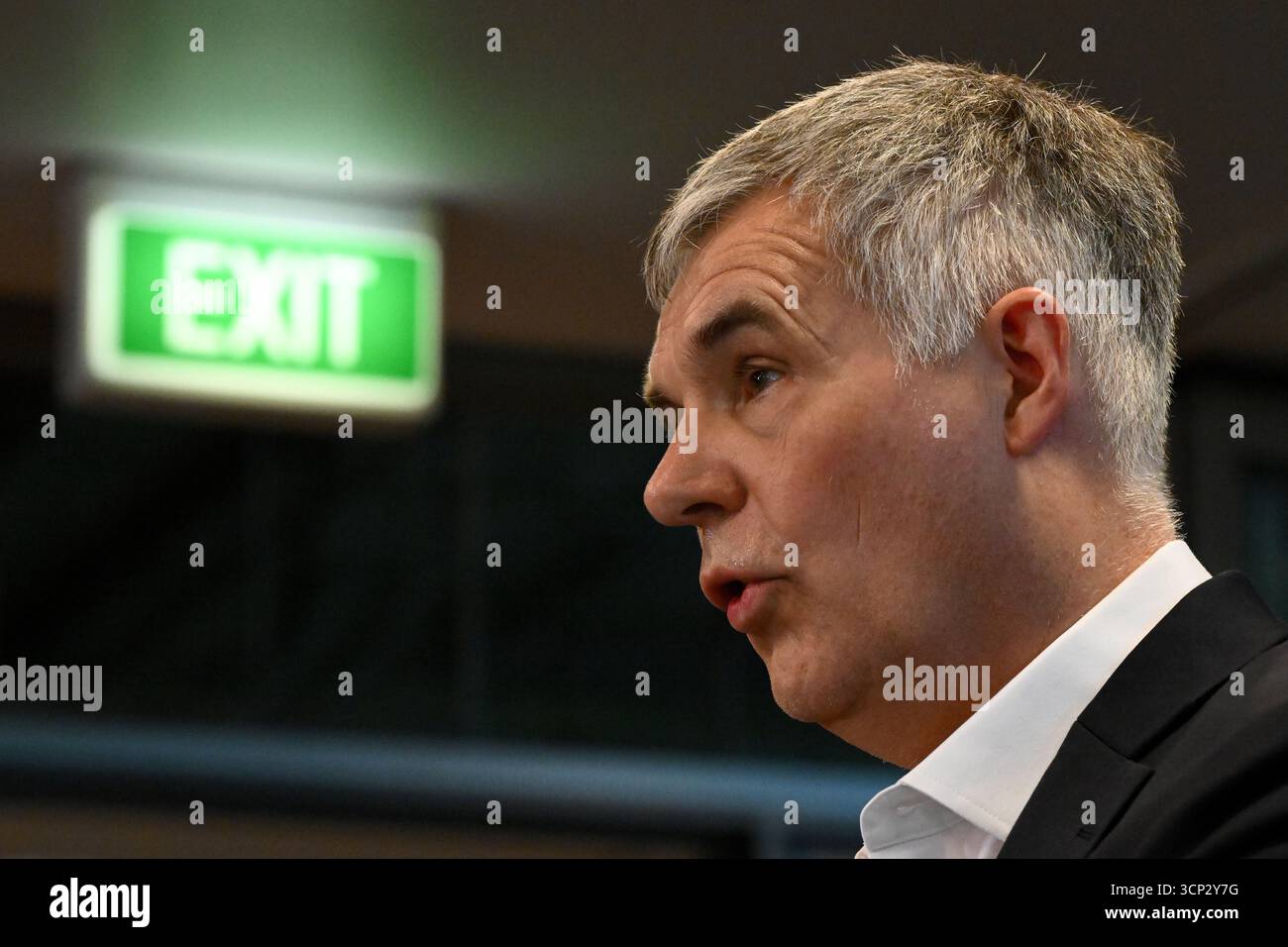 Optus Chief Executive Officer (CEO) Stephen Rue speaks to the media ...