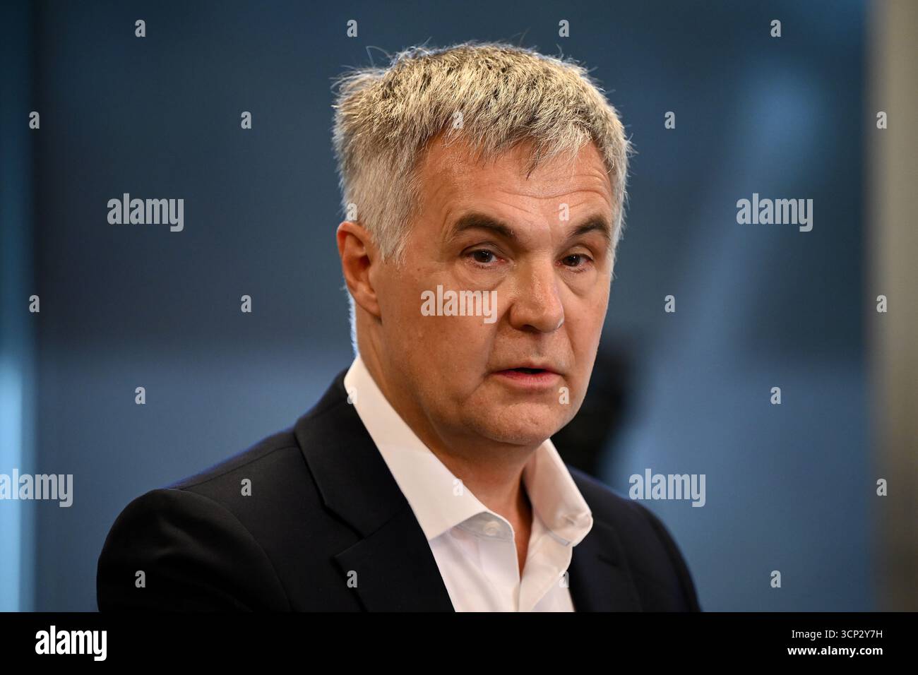 Optus Chief Executive Officer (CEO) Stephen Rue speaks to the media ...