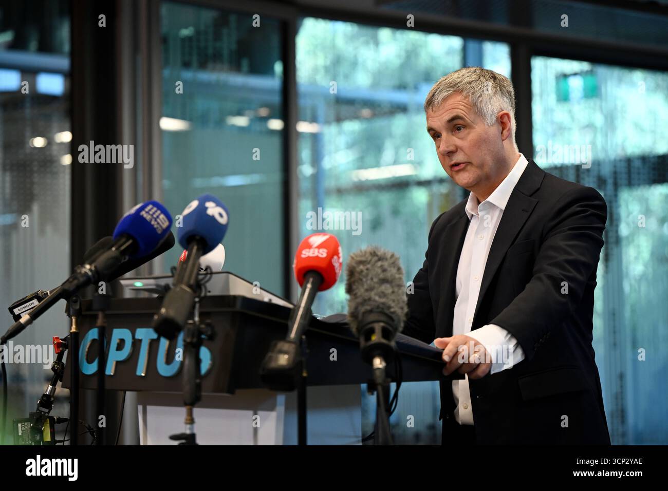 Optus Chief Executive Officer (CEO) Stephen Rue speaks to the media ...