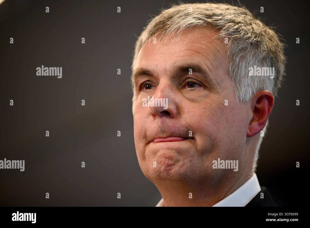 Optus Chief Executive Officer (CEO) Stephen Rue speaks to the media ...