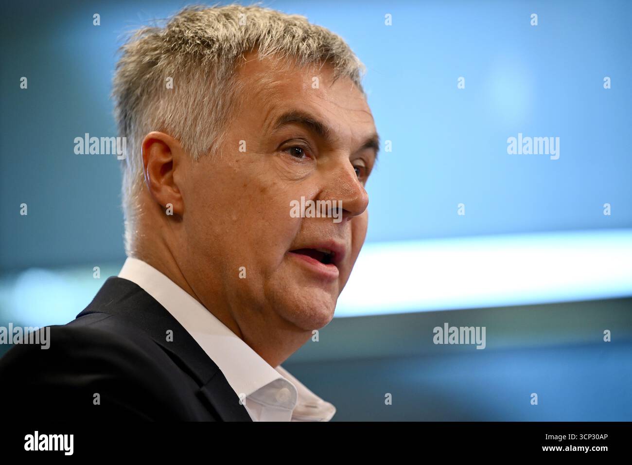 Optus Chief Executive Officer (CEO) Stephen Rue speaks to the media ...