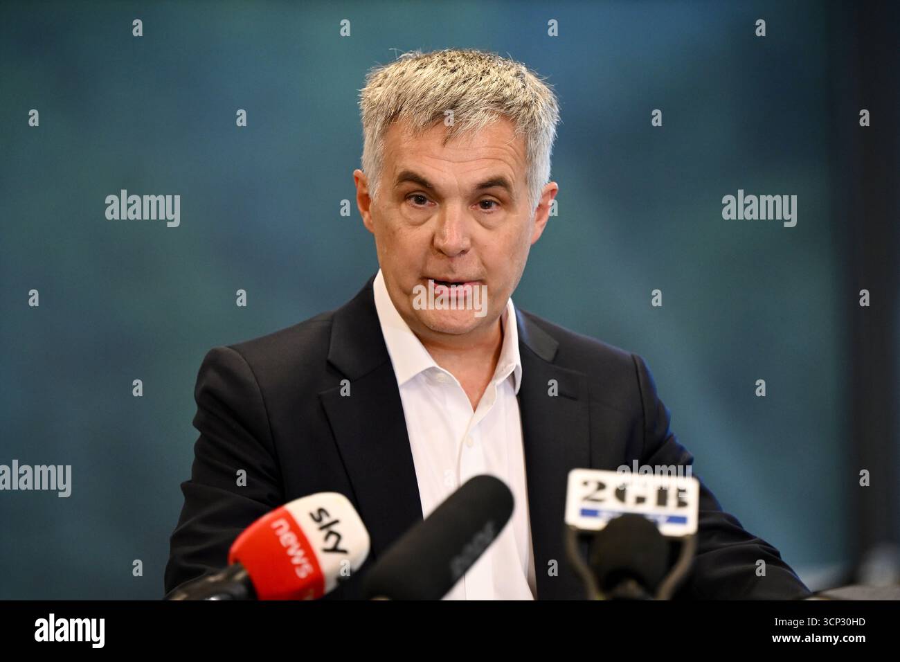 Optus Chief Executive Officer (CEO) Stephen Rue speaks to the media ...