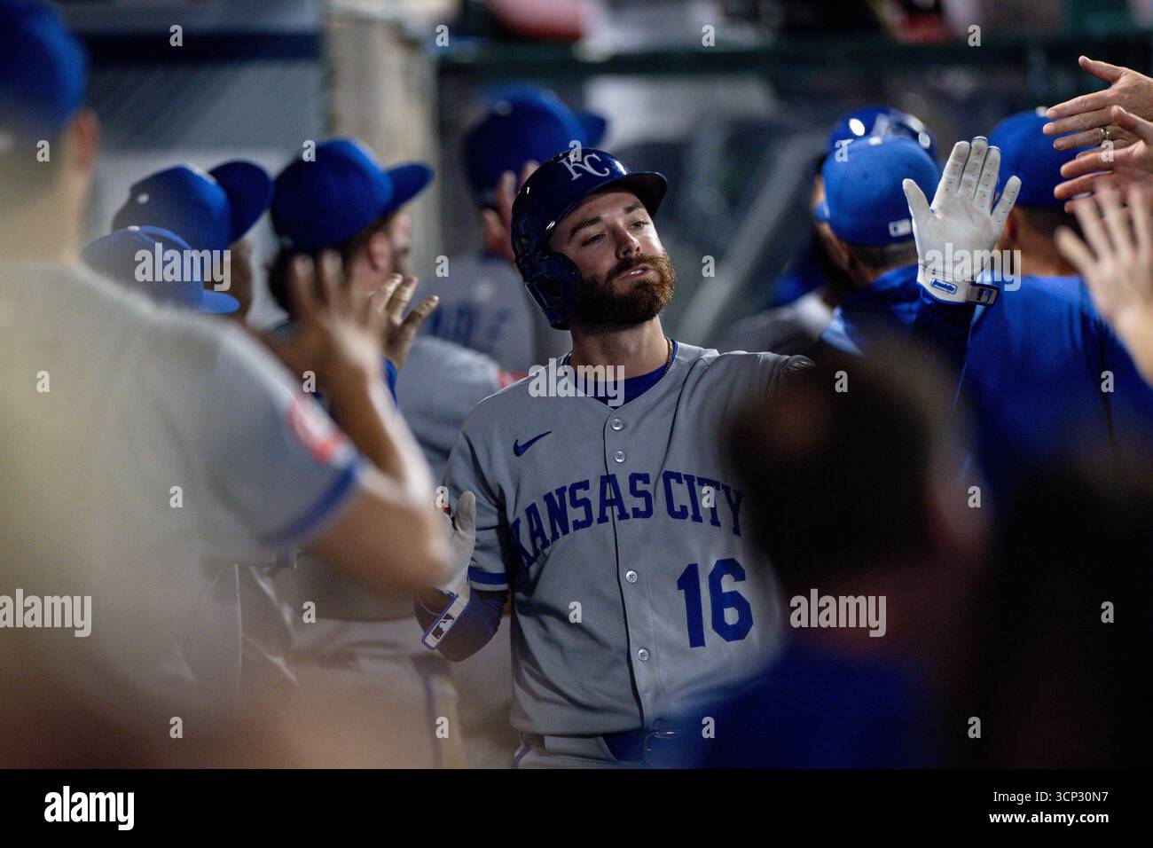 Kc Rave Kansas City Royals' John Rave (16) high-fives teammates in the dugout ...