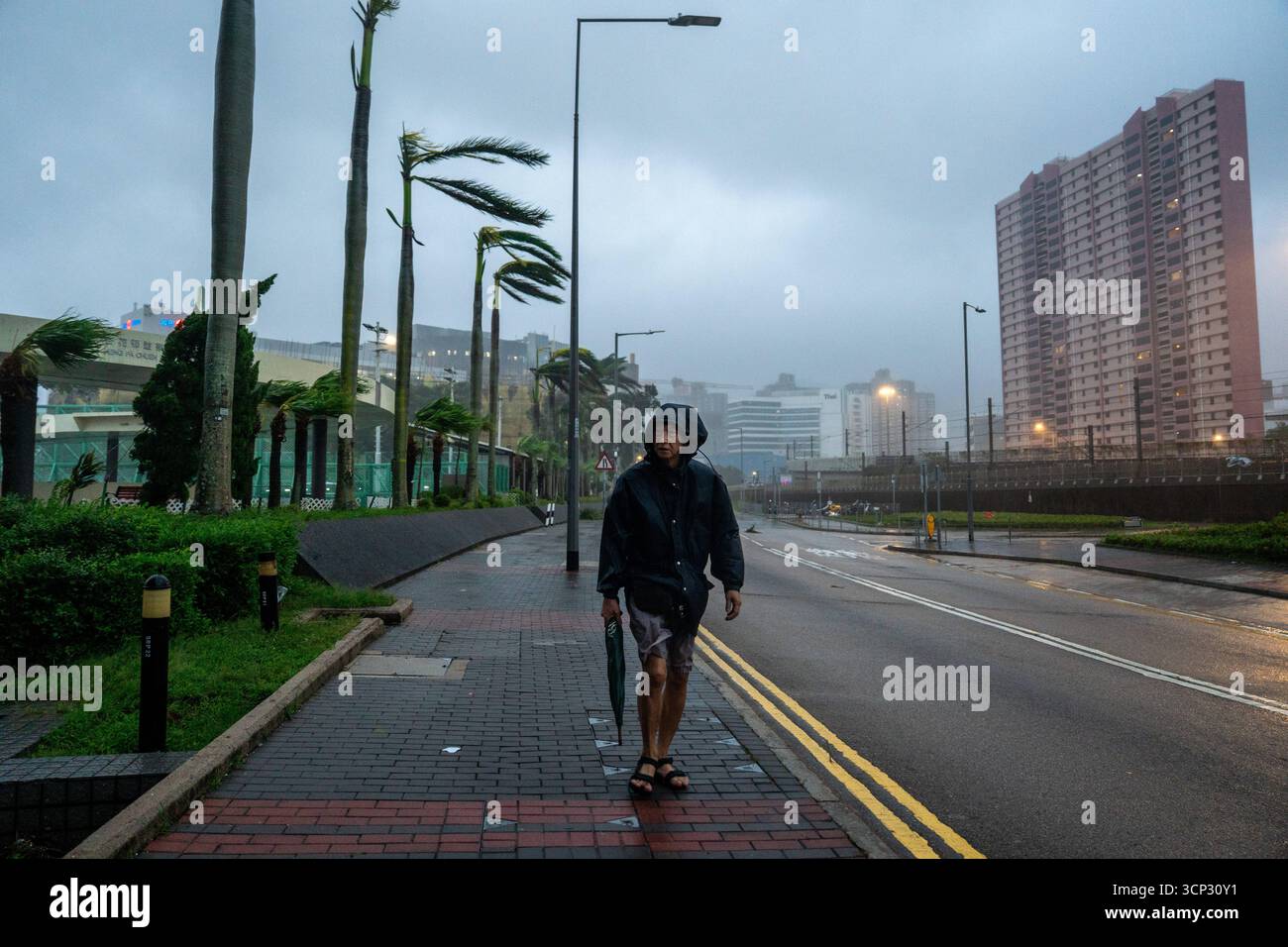 Signals Ragasa Hong Kong During Typhoon Ragasa A man reacting to strong winds at Heng ...