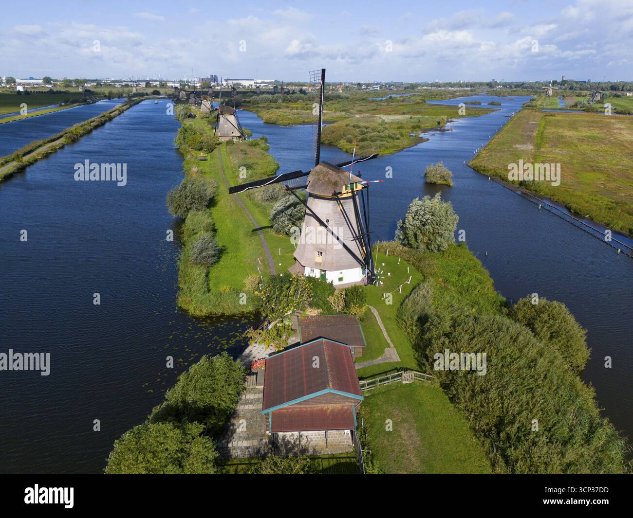 Drone view of windmills on a narrow waterway, surrounded by green nature, aerial view, windmills, Kinderdijk, Overwaard-Polder, UNESCO World Heritage Stock Photo