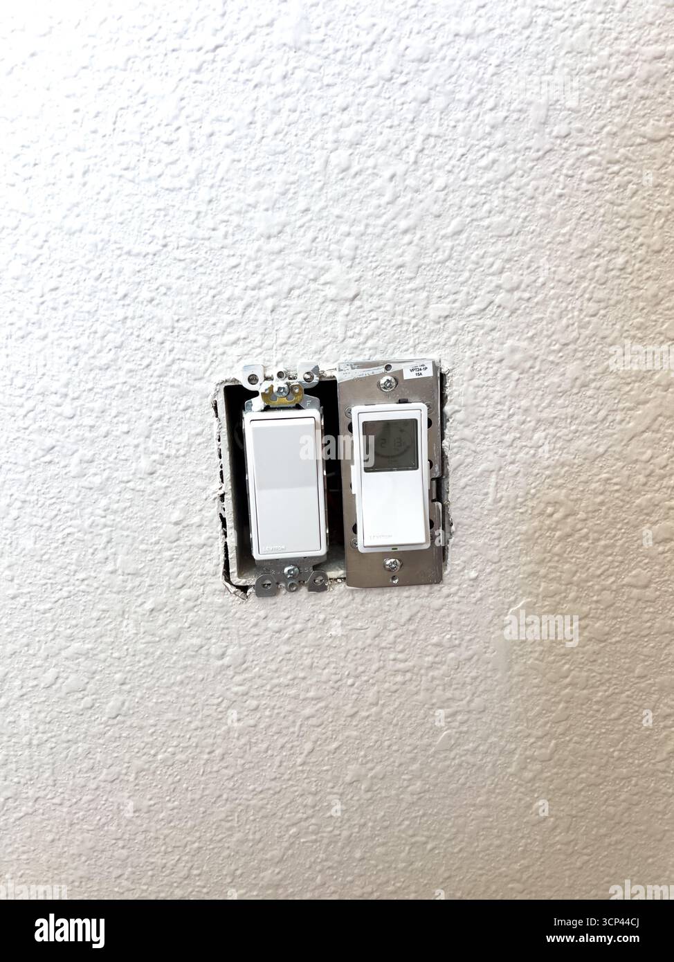 Uncovered Light Switch on Painted Wall Stock Photo