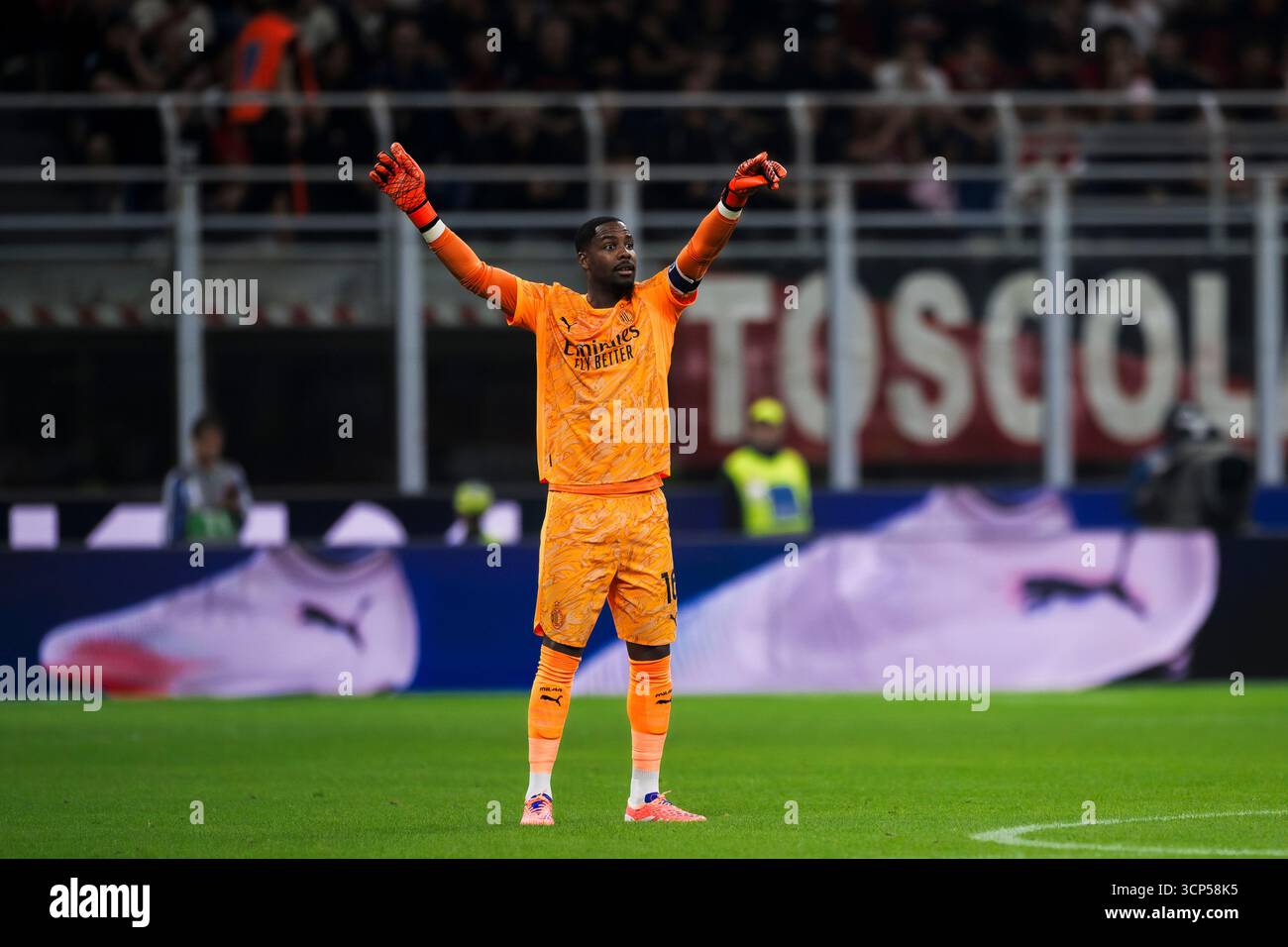 Mike Maignan of AC Milan gestures during the Coppa Italia football ...