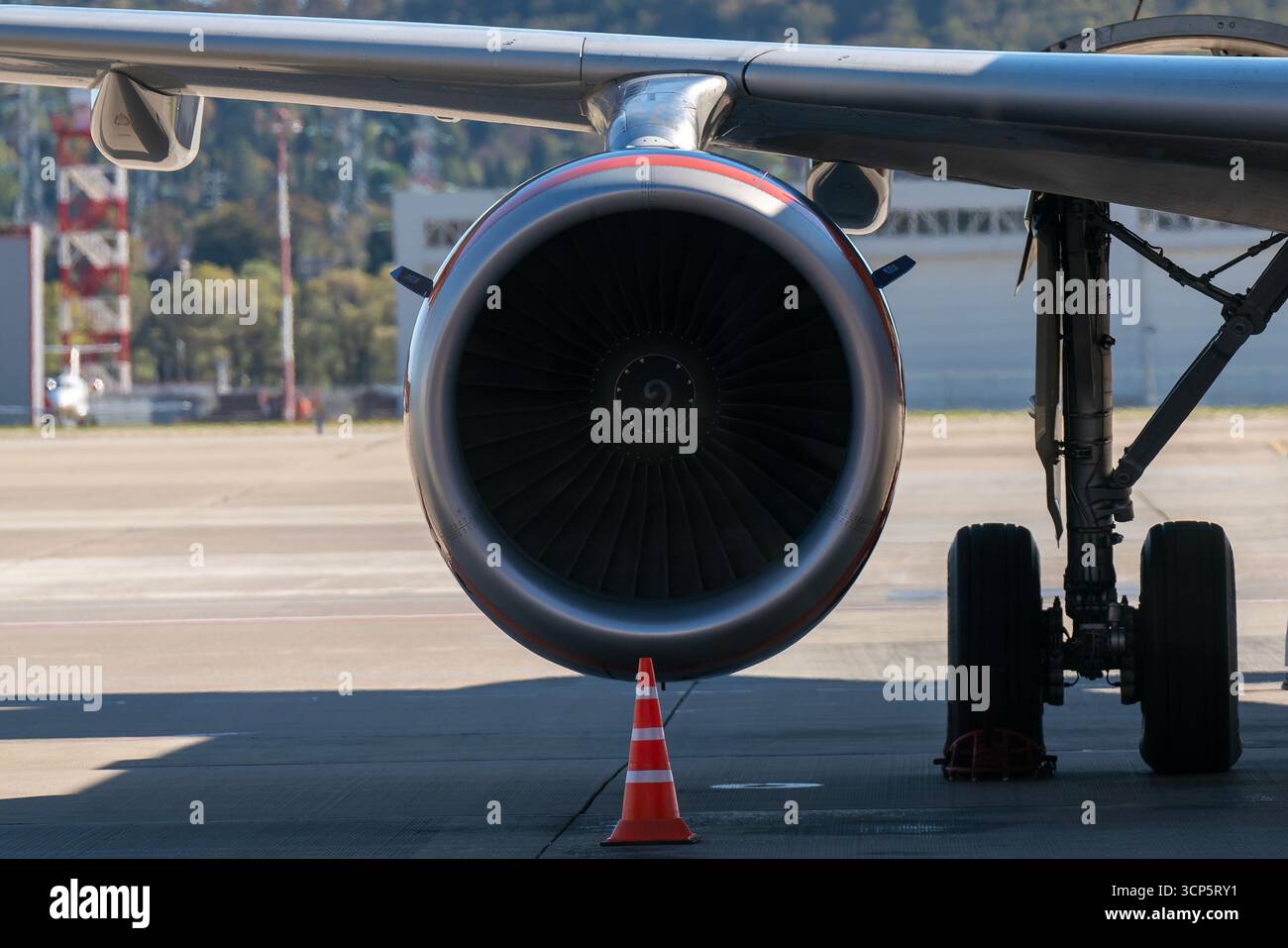 A jet engine pod under the wing of a passenger airplane Stock Photo - Alamy