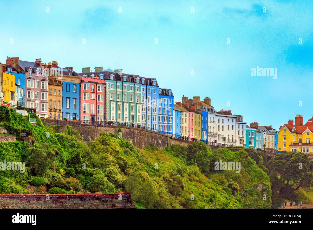 A row of multi coloured hotels line The Norton and overlook the harbour in Tenby, Pembrokeshire, South Wales, UK Stock Photo