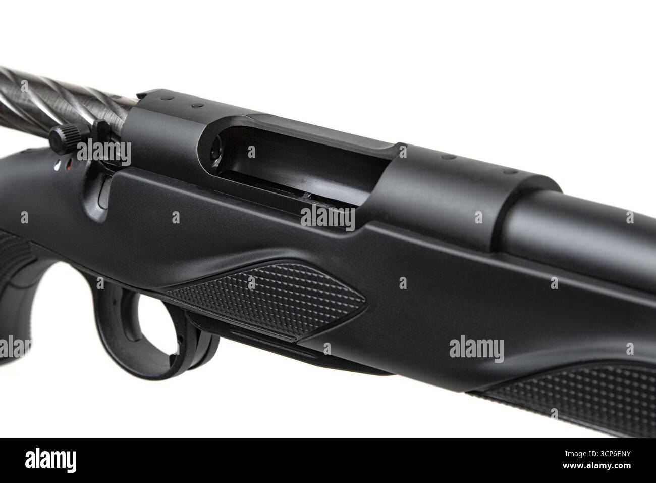 A close-up of a bolt-action rifle showing the receiver and spiral ...