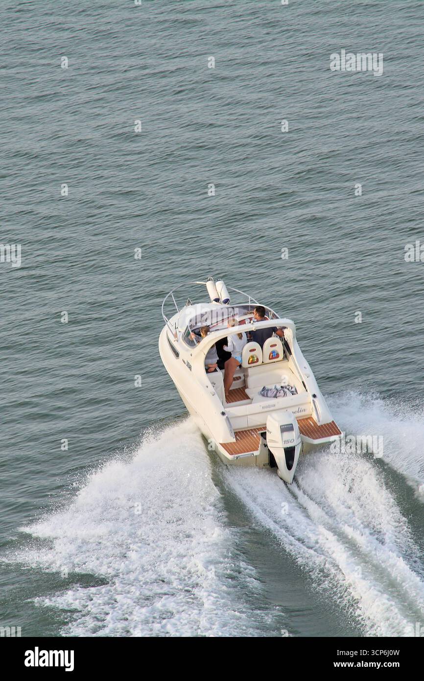 White motorboat speeding across hi-res stock photography and images - Alamy