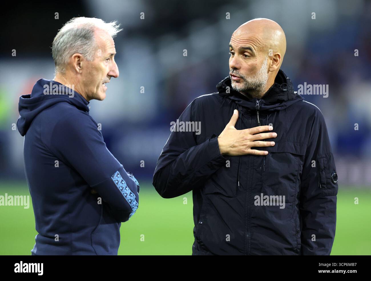 Manchester City manager Pep Guardiola (right) speaking with Head of ...