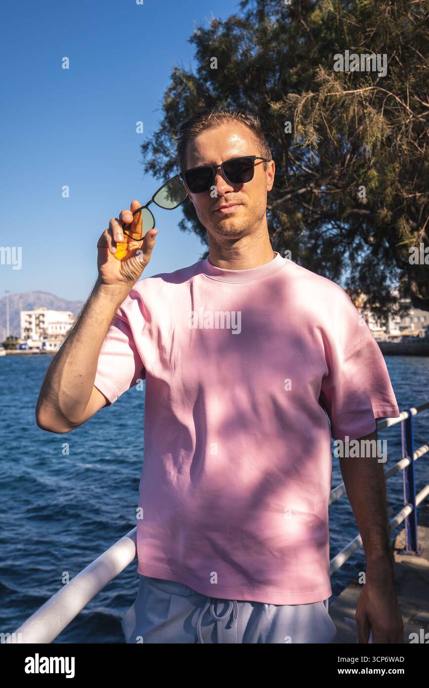 Man in pink shirt hi-res stock photography and images - Alamy