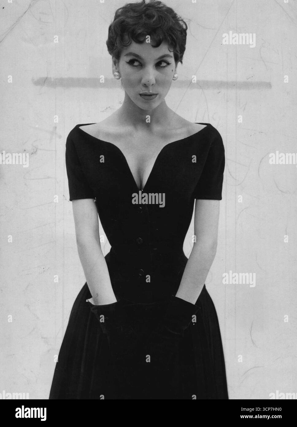 Black dress revealing dress hi-res stock photography and images - Alamy