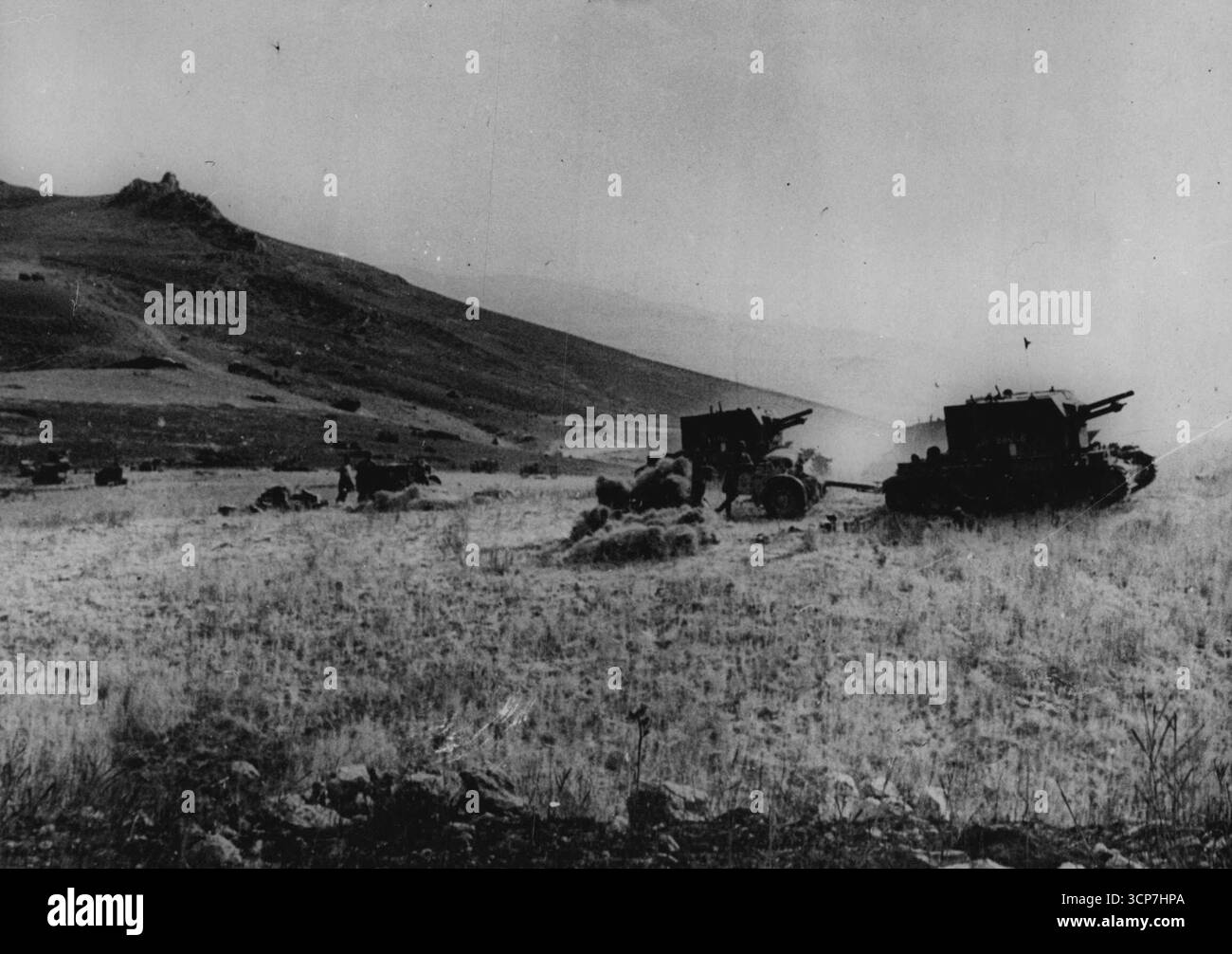 The 'Bishop' - Deadly Gun-Tank Combination In Sicily Action, First Pictures - 25 pdr guns mounted on Valentine tank chassis are known as 'Bishops' in the Middle East. These self-propelled guns are doing good work in the mountainous country of Sicily. First pictures to be released of a deadly gun-tank combination which contributed to the Allied victories in North Africa. Picture taken at and R.A. Battery site in Sicily shows. August 07, 1943. (Photo by British Official Photograph). Stock Photo