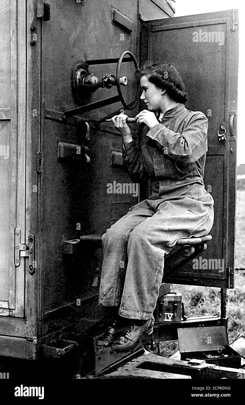 A.T.S. Maintain Radio location - Craftswomen Doris Birt, aged 21, of Brixton London S.W., is a radio mechanic at an 4.4 command radio workshops. A clerk in an insurance company in the city before the war. She is now a highly skilled expert in repairing radio location environment. Here she is overhauling part of a radio location receiver. August 16, 1943. (Photo by London News Agency Photos). Stock Photo