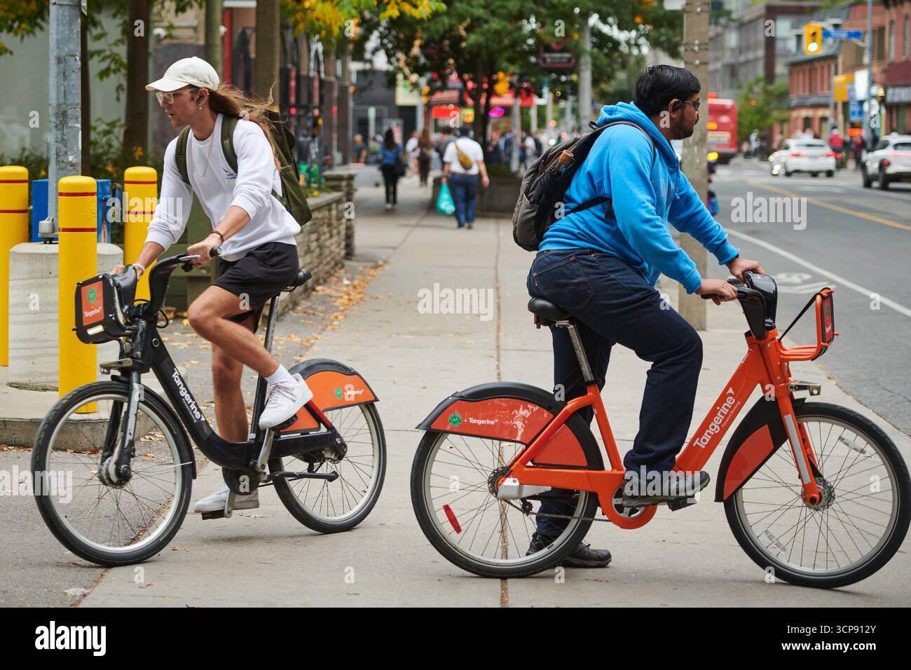 People using Bike Share Toronto bicycles cycle in Toronto, on Wednesday ...