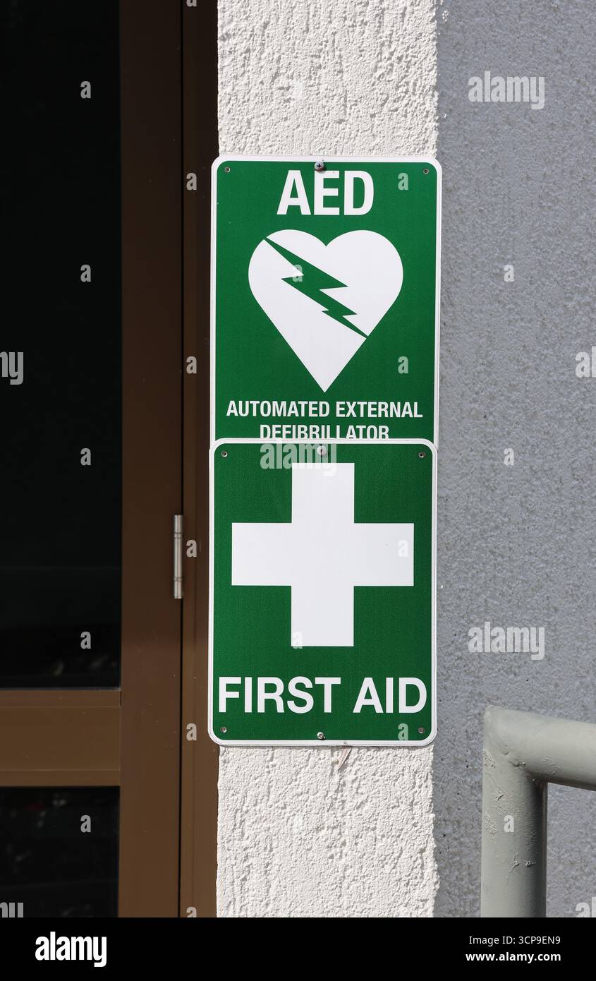 Automated External Defibrillator and First Aid signs attached to the ...