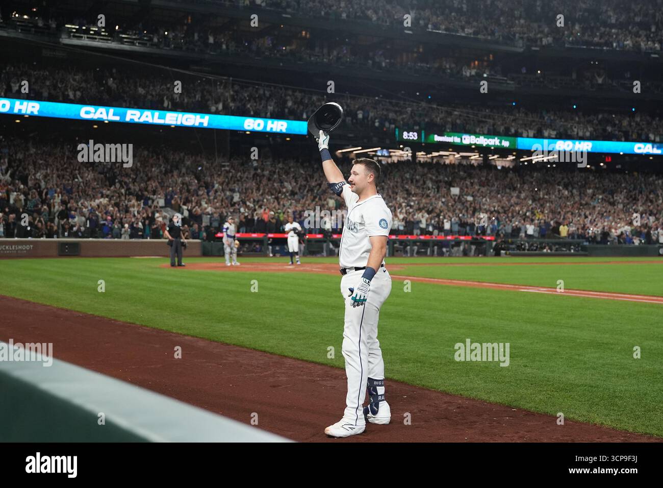 Cal Raleigh Wave Seattle Mariners' Cal Raleigh waves to the crowd after hitting his 60th ...