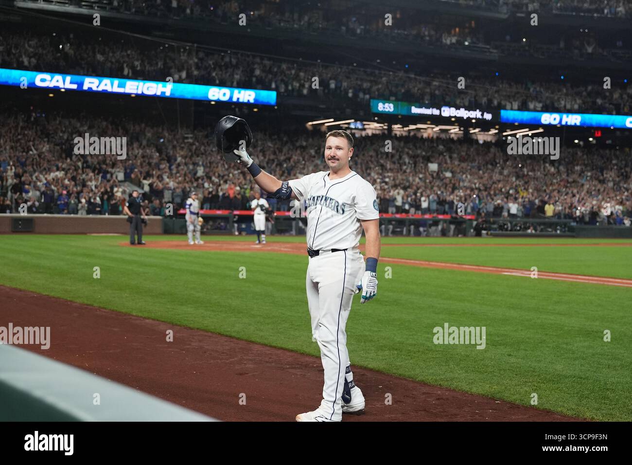 Cal Raleigh Wave Seattle Mariners' Cal Raleigh waves to the crowd after hitting his 60th ...