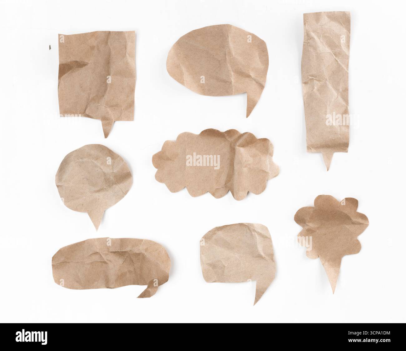 Crumpled brown paper speech bubbles for creative design and communication projects Stock Photo