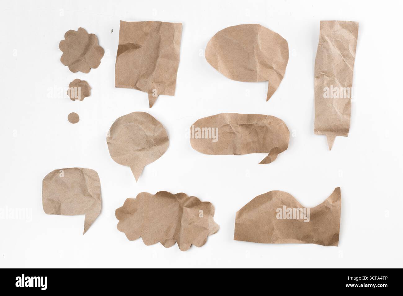 Crafting conversation bubbles from crumpled paper for creative projects Stock Photo
