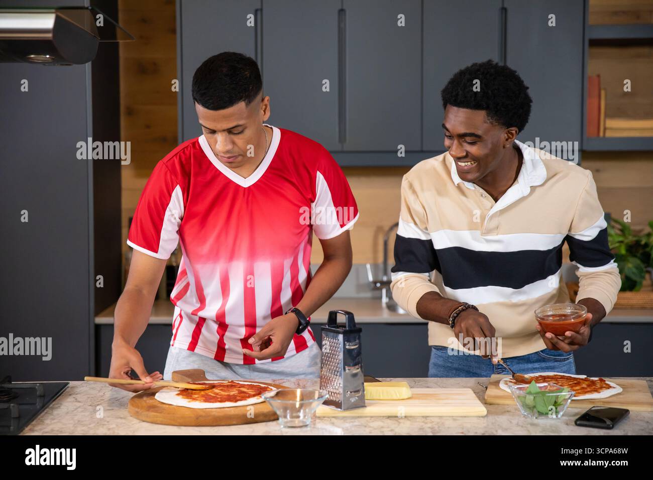 Diverse male friends spreading hi-res stock photography and images - Alamy