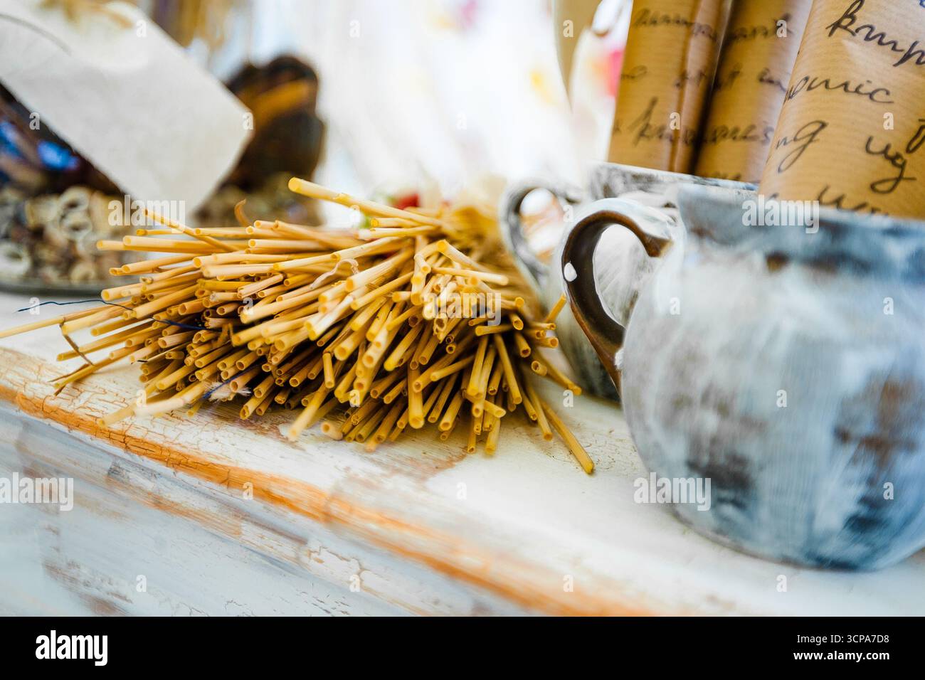 Crafting materials and tools arranged on a rustic table in a creative workspace Stock Photo