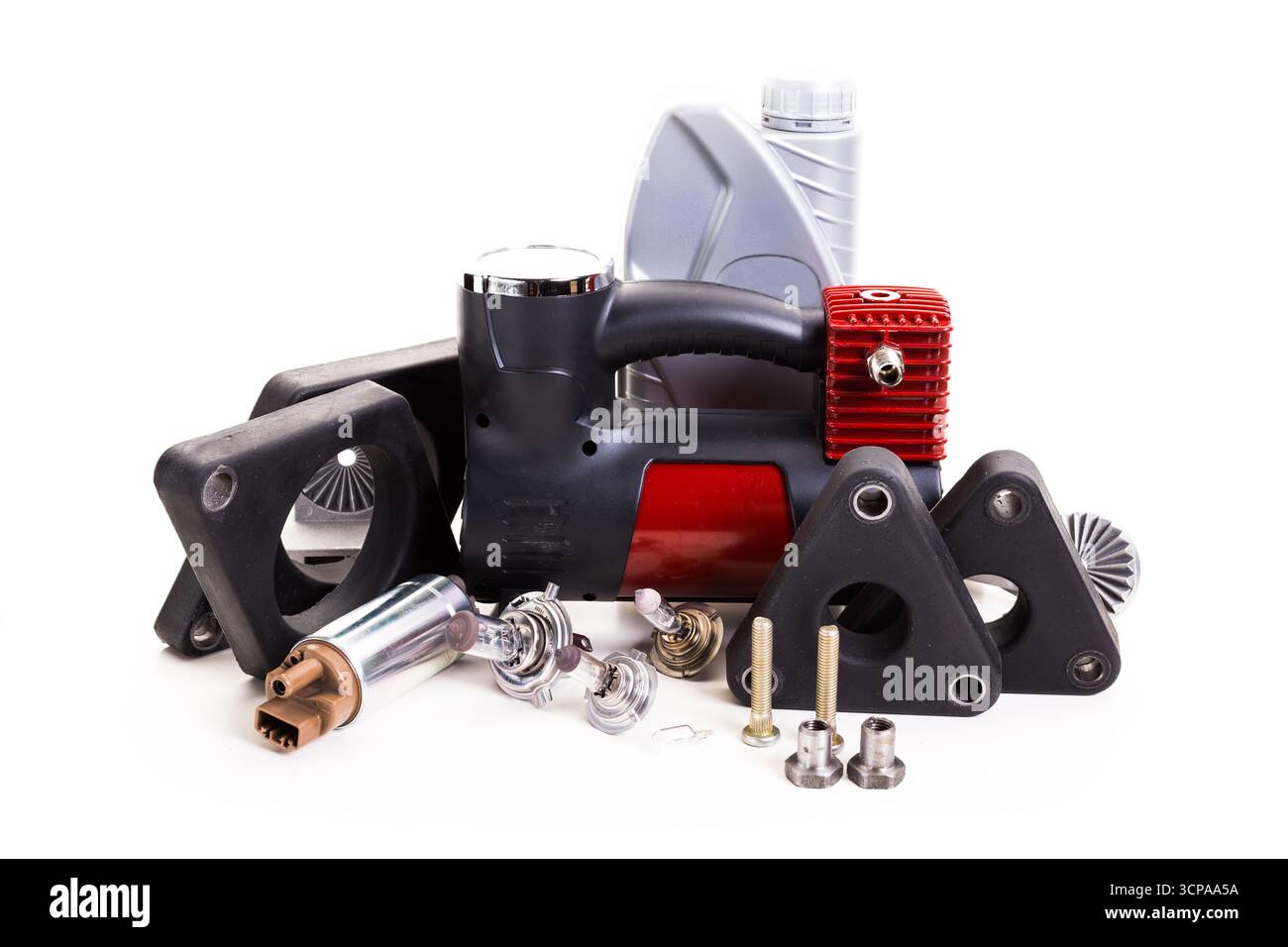 Components of automotive equipment scattered on a clean surface ready for assembly Stock Photo