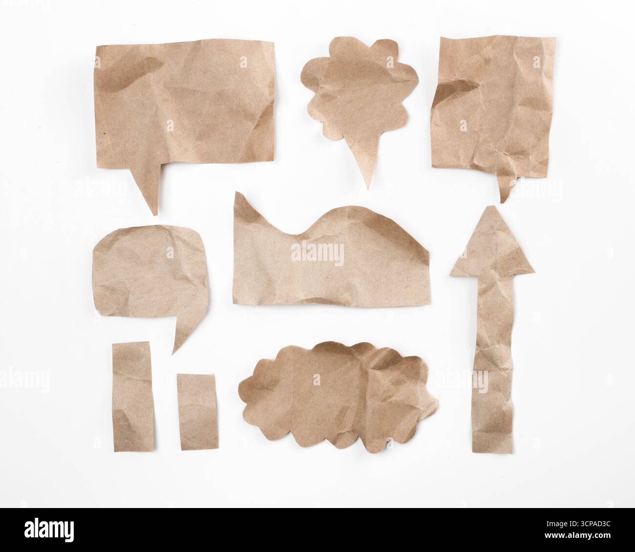 Creative arrangement of crumpled paper shapes for design and ...
