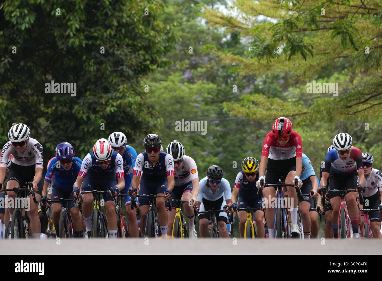 Canada's Isabella Holmgren, second from right, pedals in the pack ...